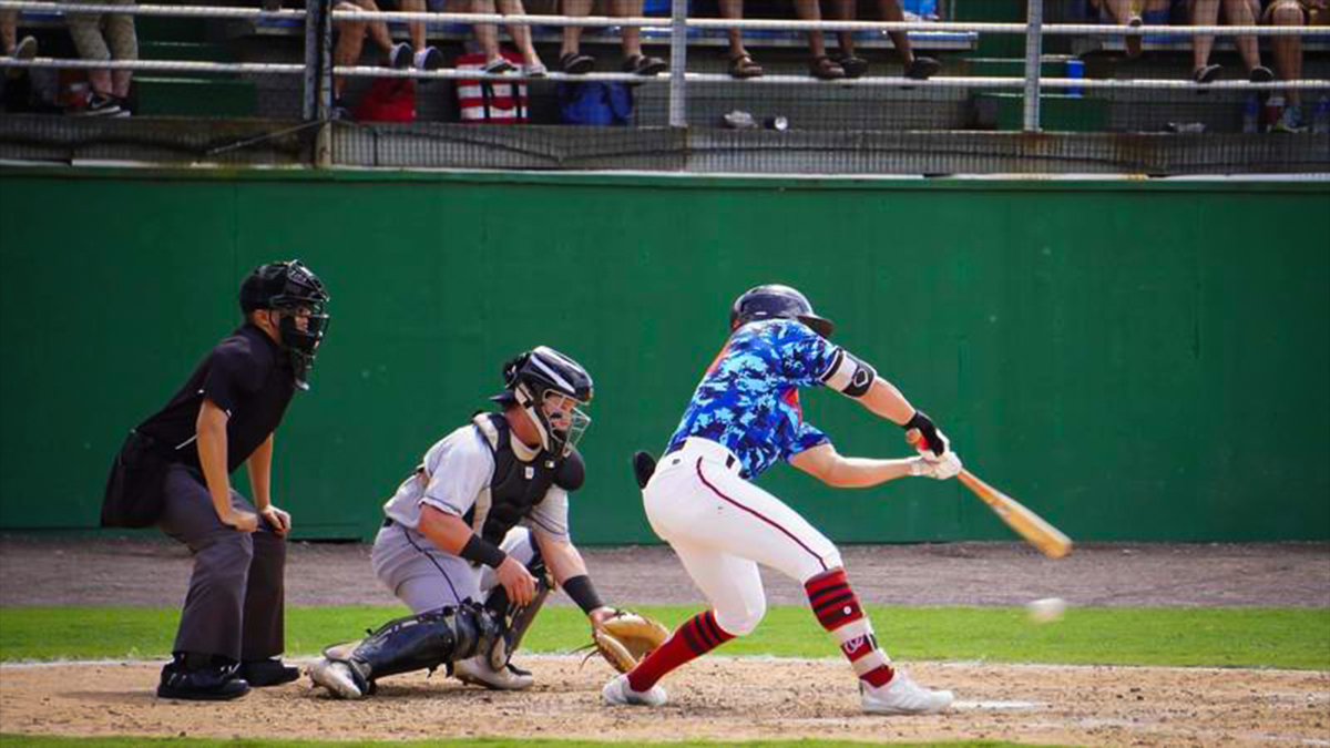 player swinging at a pitch