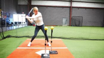 Megan Rembielak showing quick hands in softball hitting drill